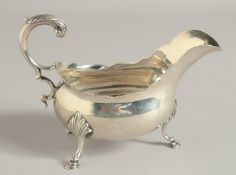 A GEORGE III SILVER SAUCE BOAT with waved rim three pad feet. London 1773. Maker: S S.