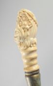A WALKING STICK with carved bone erotic handle.