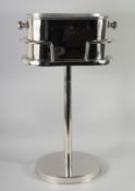 A CHROME WINE COOLER on a stand.