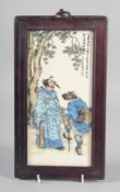 A CHINESE FRAMED PORCELAIN PLAQUE. 9.5ins x 4.5ins.