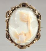 A VICTORIAN OVAL CAMEO, a young lady and a bird. 4cm x 3cm.