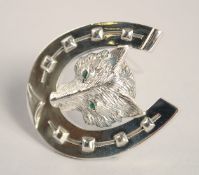 A LARGE SILVER HORSESHOE FOX BROOCH.