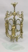 A LARGE GILT BRONZE HALL LANTERN with carytid figures and frosted glass panels (one panel off).