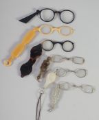 A PAIR OF GEORGIAN SILVER AND MOTHER OF PEARL FOLDING GLASSES AND FIVE OTHER PAIRS. (6).