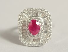 A SUPERB 18CT GOLD RUBY AND DIAMOND RING.