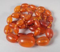 A GOOD AMBER GRADUATED BEAD NECKLACE, 19ins long, 44 beads. 17gms.