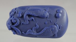 A LAPIS PENDANT carved with fishes. 2.5ins high.