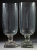 A GOOD PAIR OF ETCHED GLASS HURRICANE LAMPS on square bases.