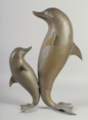 A MODERN ART BRONZE OF TWO DANCING DOLPHINS. 18ins high.
