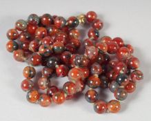 A GOOD JADE BEAD NECKLACE, 84 beads, 30ins long, 64gms.