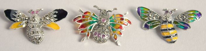 THREE SILVER AND ENAMEL BUG BROOCHES.