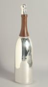 A SILVER PLATED CHAMPAGNE BOTTLE COCKTAIL SHAKER.