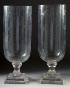 A GOOD PAIR OF ETCHED GLASS HURRICANE LAMPS on square bases.