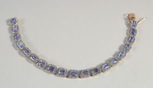 A GOOD AMETHYST AND DIAMOND LINE BRACELET.
