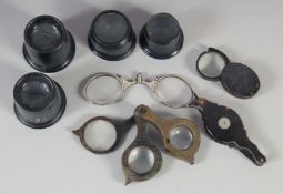 FOUR MAGNIFYING LOOPS, FOUR FOLDING LOOPS.