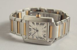 A GENTLEMAN'S CARTIER AUTOMATIC STEEL AND GOLD TANK WRIST WATCH. No. CC231403.