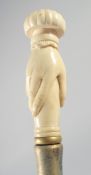 A WALKING STICK with carved bone hand handle.