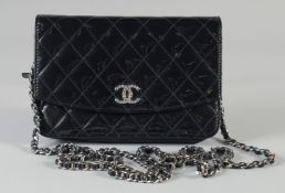 A GOOD CHANEL BLACK PATENT LEATHER SHOULDER BAG with chrome double C. 19cm long, 13cm high, chain