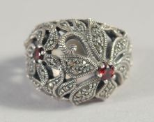 A SILVER GARNET AND MARCASITE RING.