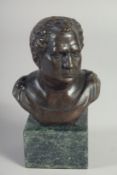 A SMALL BRONZE BUST OF A MAN on a marble base. 5ins high.