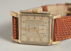 A GOOD HAMILTON GOLD WRIST WATCH with snake skin strap.