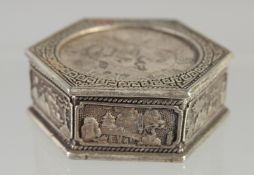 A CHINESE HEXAGONAL WHITE METAL COIN BOX. 1.5ins