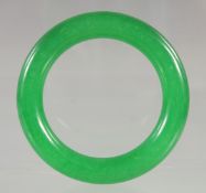 AN APPLE GREEN JADE BRACELET. 3ins diameter.