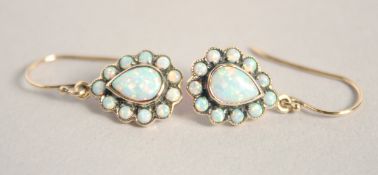 A PAIR OF 9CT GOLD PEAR SHAPED OPAL EARRINGS.