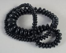 A BLACK JET GRADUATED BEAD NECKLACE. 26ins long, 82gms.