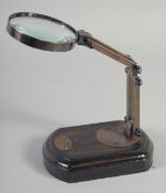 A MAGNIFYING GLASS on a stand.