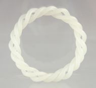 A WHITE JADE DOUBLE TWIST BANGLE. 3ins diameter.