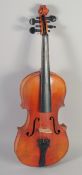 A VIOLIN IN A CASE, two piece back, bears label: An... st...... 23.5ins long.