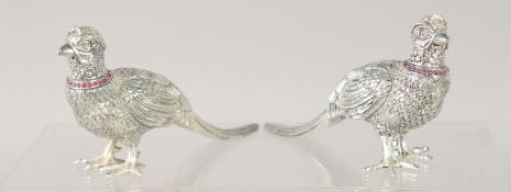 A PAIR OF PHEASANT SALT AND PEPPERS. 4.5ins long.