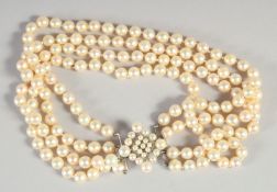 A GOOD FOUR ROW PEARL CHOKER AND CLASP.
