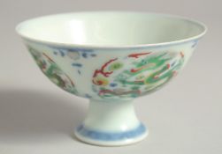 A CHINESE MING STYLE DOUCAI PORCELAIN DRAGON STEM BOWL, the interior of the base with an extended