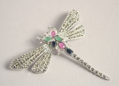 A SILVER, RUBY & EMERALD DRAGONFLY BROOCH.