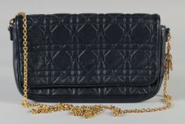 A CHRISTIAN DIOR PADDED BLACK LEATHER SHOULDER BAG. 24cm long, 15cm high with long gilt strap,