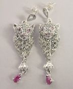 A PAIR OF SILVER, RUBY, MARCASITE PANTHER EARRINGS.