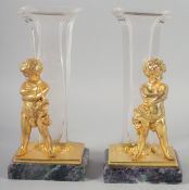 A PAIR OF ORMOLU AND GLASS FIGURAL VASES with blue John style bases. 9ins high.