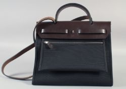 A SUPERB HERMES BROWN-BLACK HAND BAG with chrome clasp. 31cm lonfg x 27cm high.