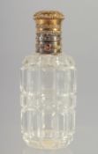 A GOOD CUT GLASS SCENT BOTTLE with gold top. 3.5ins long.