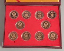 A COLLECTION OF TEN CHINESE COINS in presentation box.