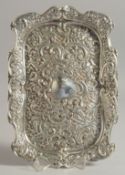 A VICTORIAN SILVER RECTANGLAR TRINKET TRAY with floral repousse decoration. 112ins long . Birmingham
