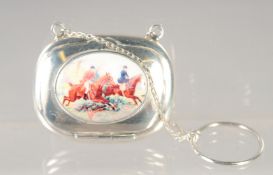 A SMALL SILVER COMPACT ON A CHAIN with an enamel of The Hunt. 1ins x 0.25ins.