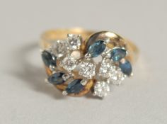 AN 18CT YELLOW GOLD SAPPHIRE AND DIAMOND COCKTAIL RING
