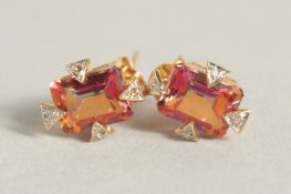 A PAIR OF 9CT GOLD TOPAZ AND DIAMOND DECO STYLE EARRINGS.