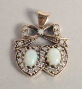 A 9CT GOLD, OPAL AND DIAMOND SWEETHEART PENDANT.