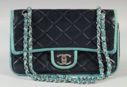 A CHANEL PADDED TURQUOISE AND BLACK LEATHER SHOULDER BAG 27cm long, 16cm high with chrome and