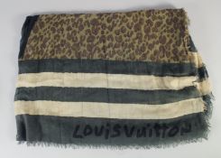 A LOUIS VUITTON SHAWL, green, cream, black and brown. 200cm x 120cm.