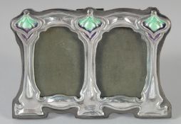 A SMALL SILVER ART NOUVEAU STYLE DOUBLE FRAME 3ins x 4ins.